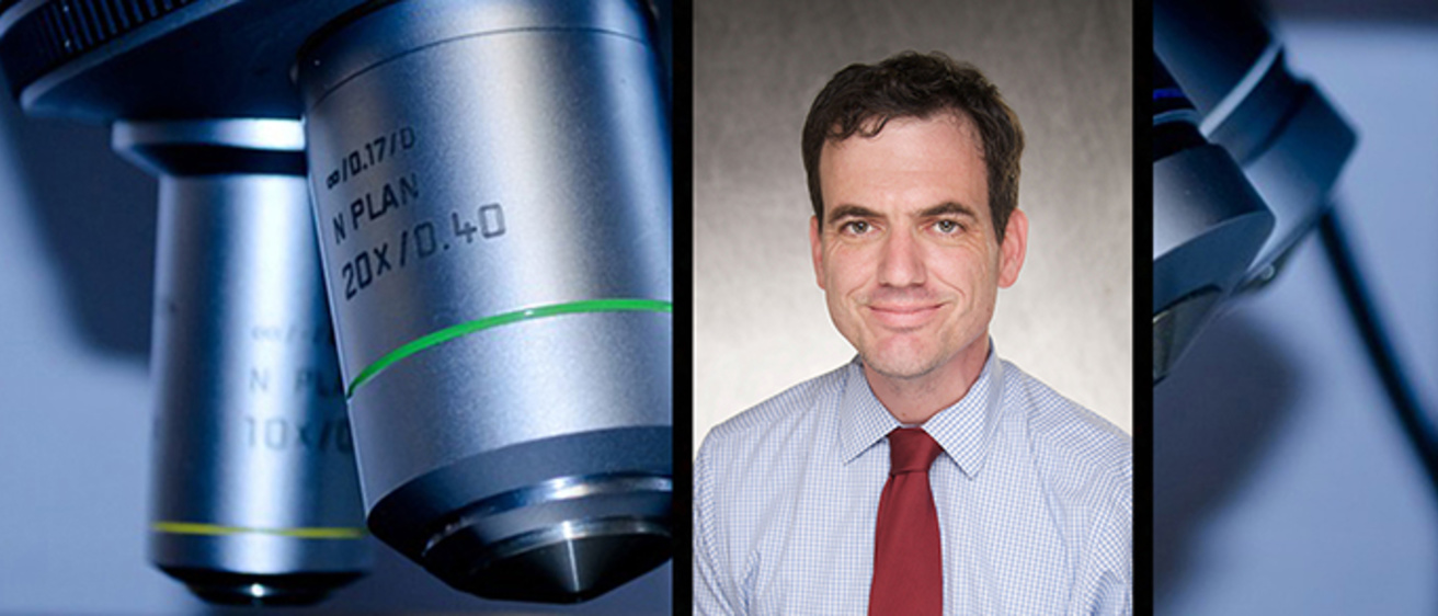 Dr. Hefti and a microscope